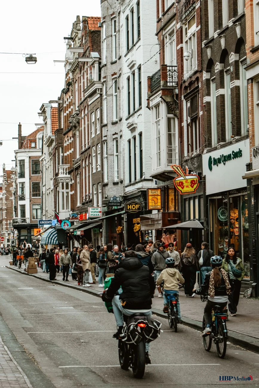 bicycles and pedestrians on amsterdam street