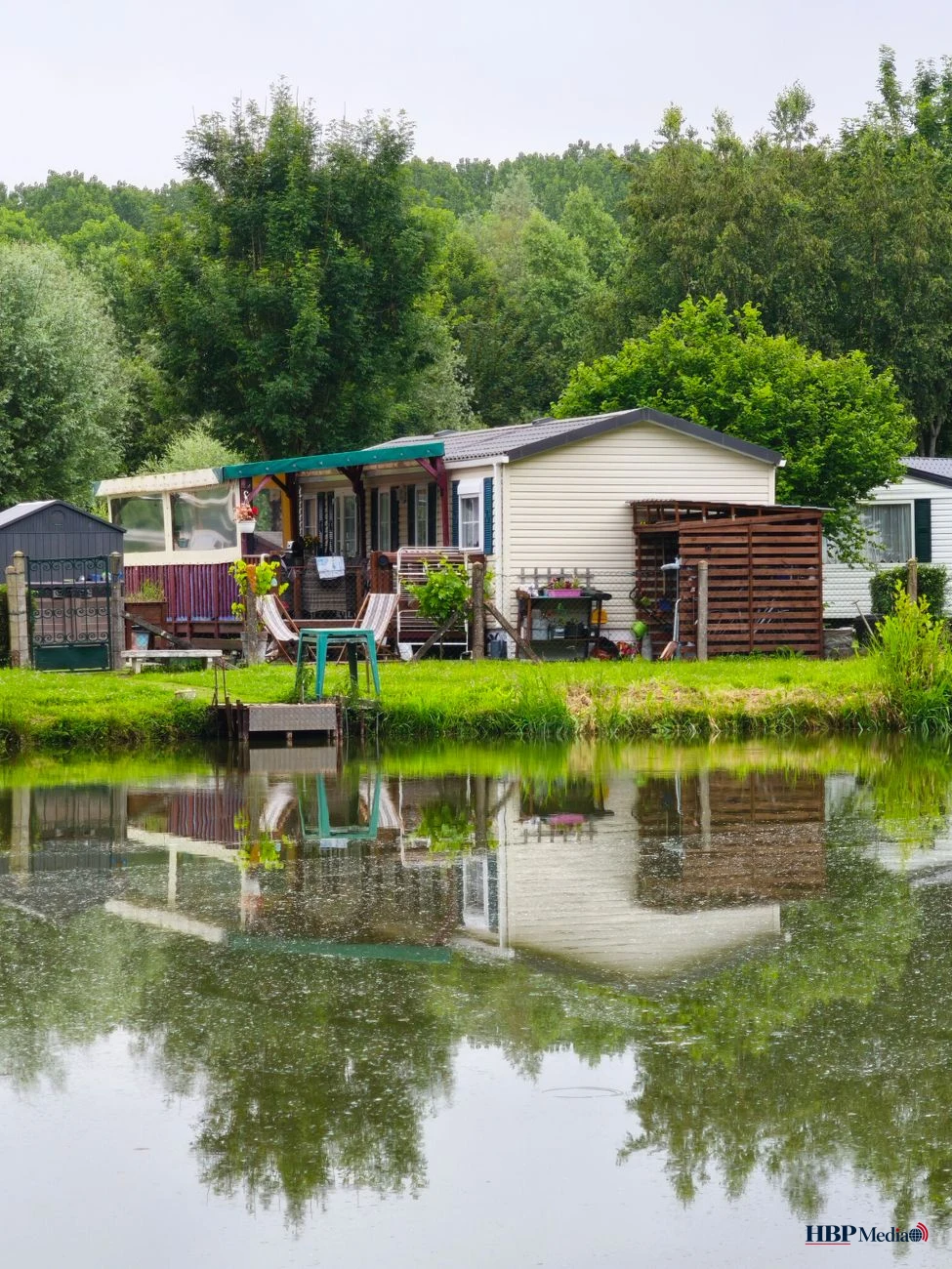 quaint lakeside mobile home in lush setting