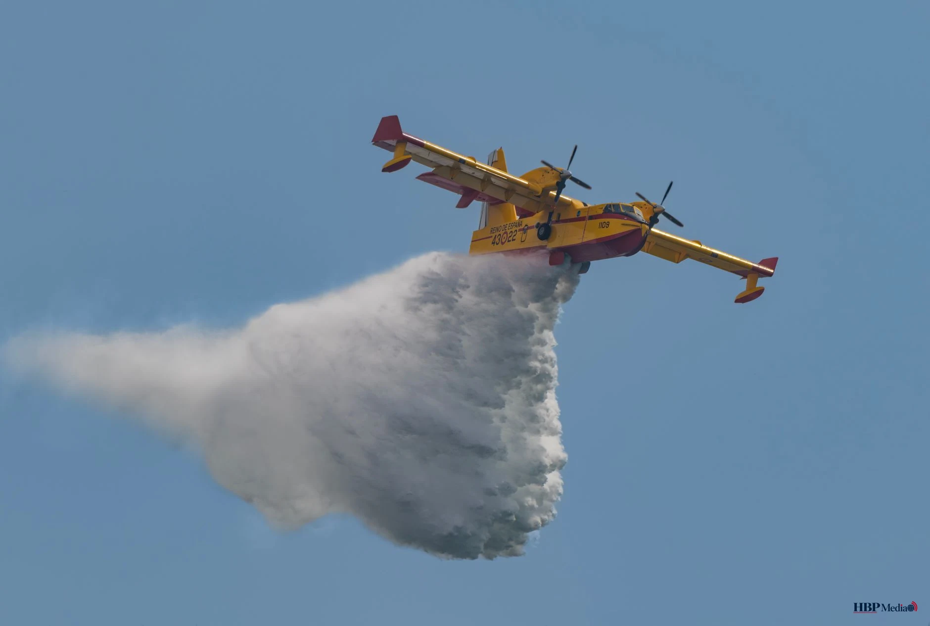 firefighting plane drops water battling blaze