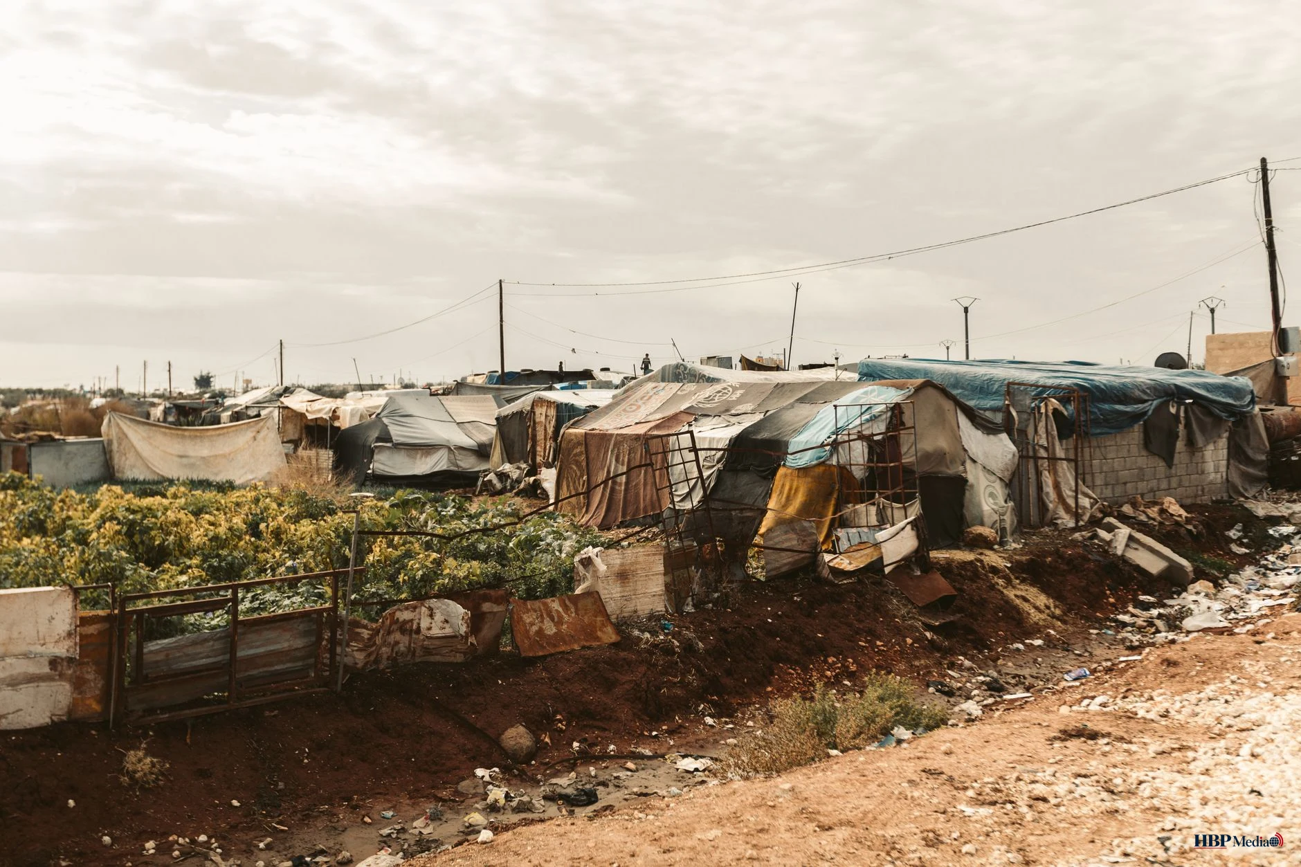 temporary shelters in refugee camp landscape