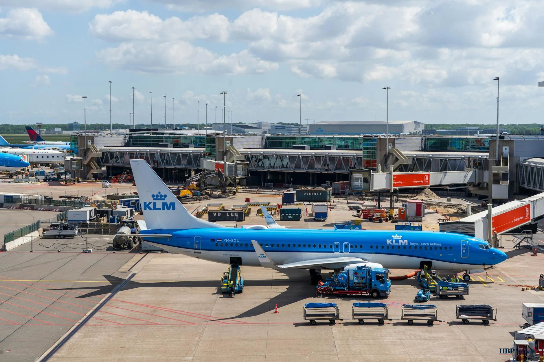 klm plane at busy airport terminal