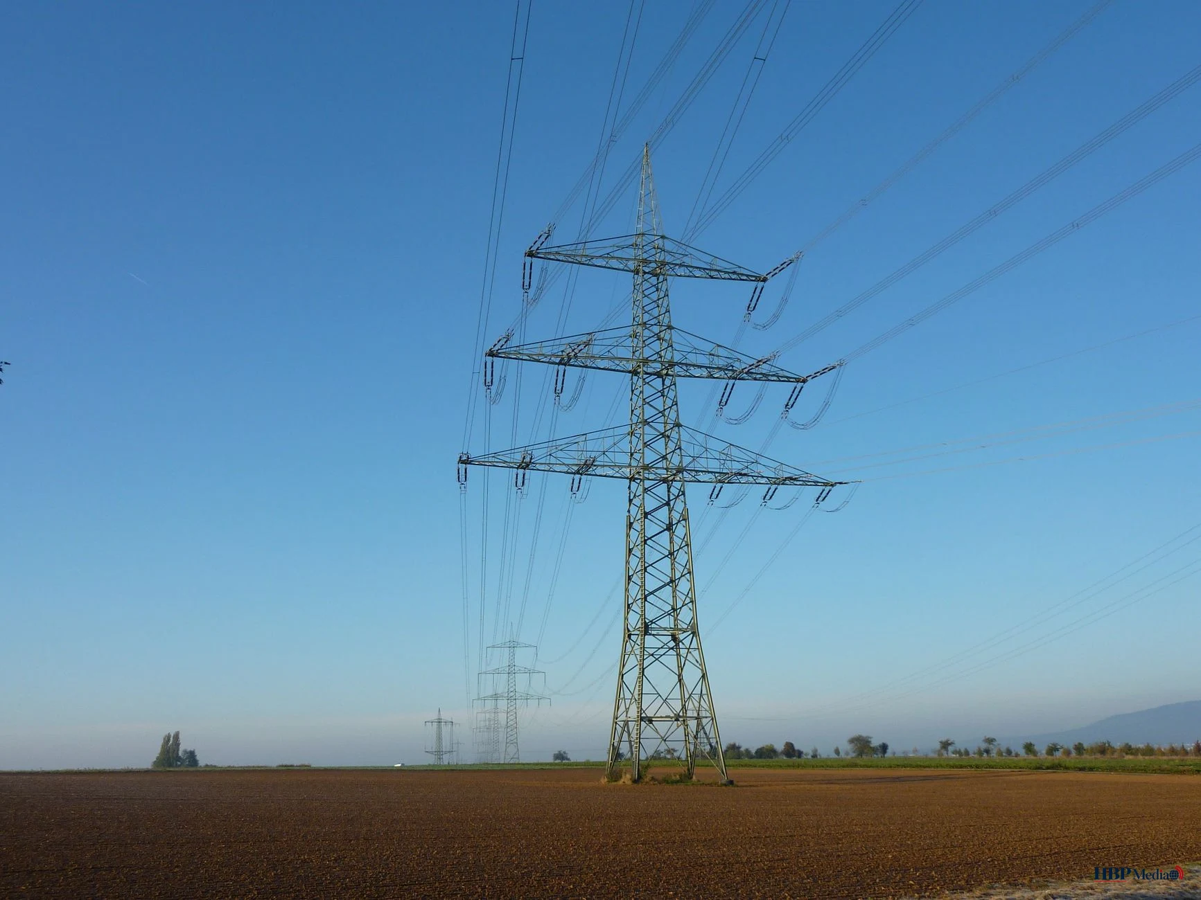 power line tower in open field