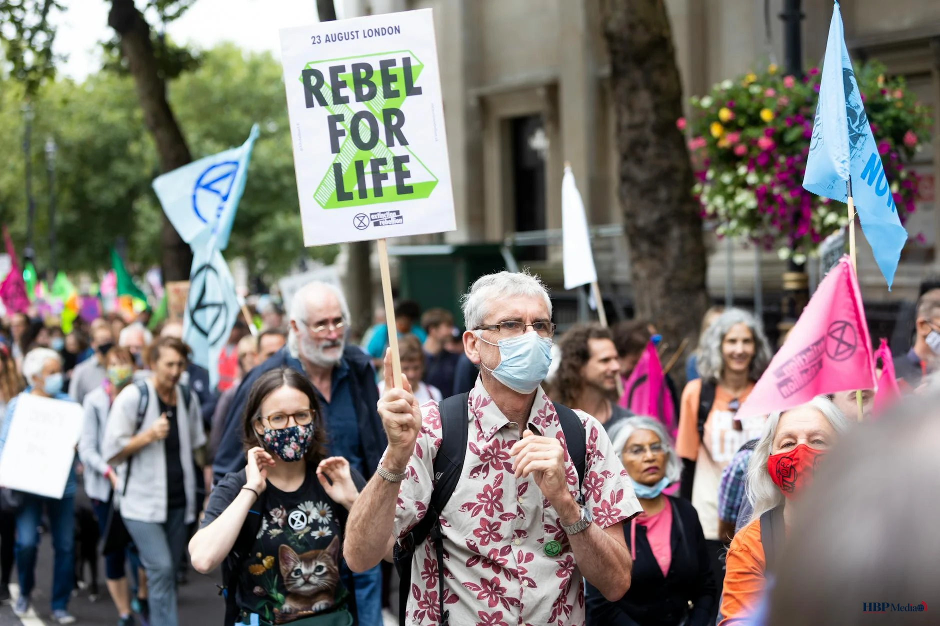 crowd of people with placards and banners on demonstration