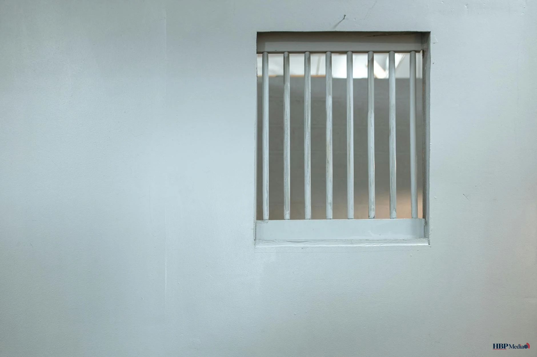 white steel bars window on a wall
