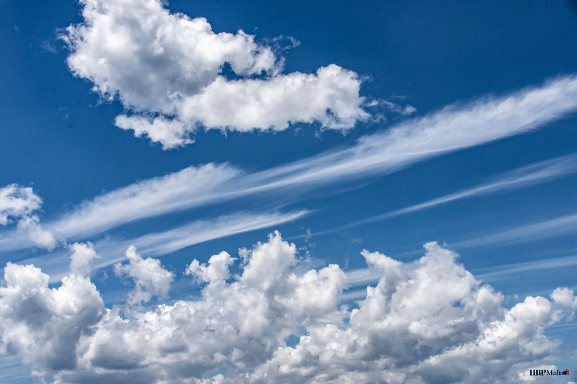 bright blue sky with fluffy clouds