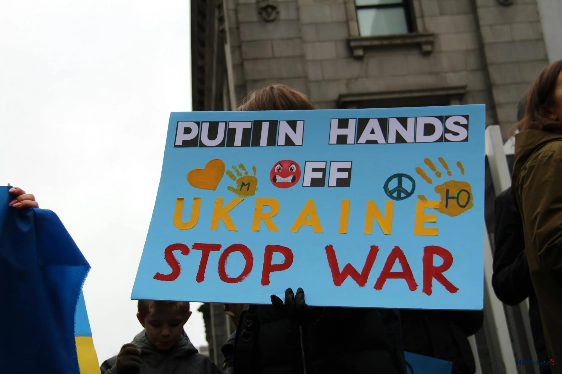 a person holding a placard on the street