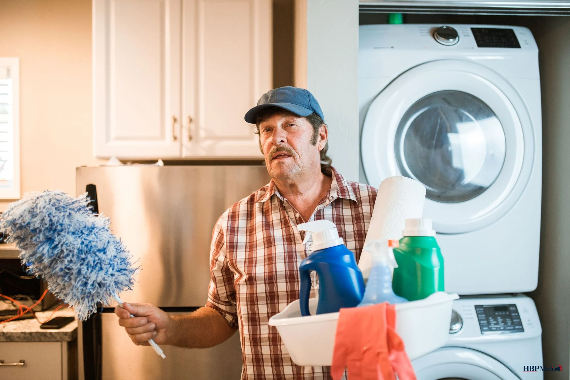 man carrying detergent bottles