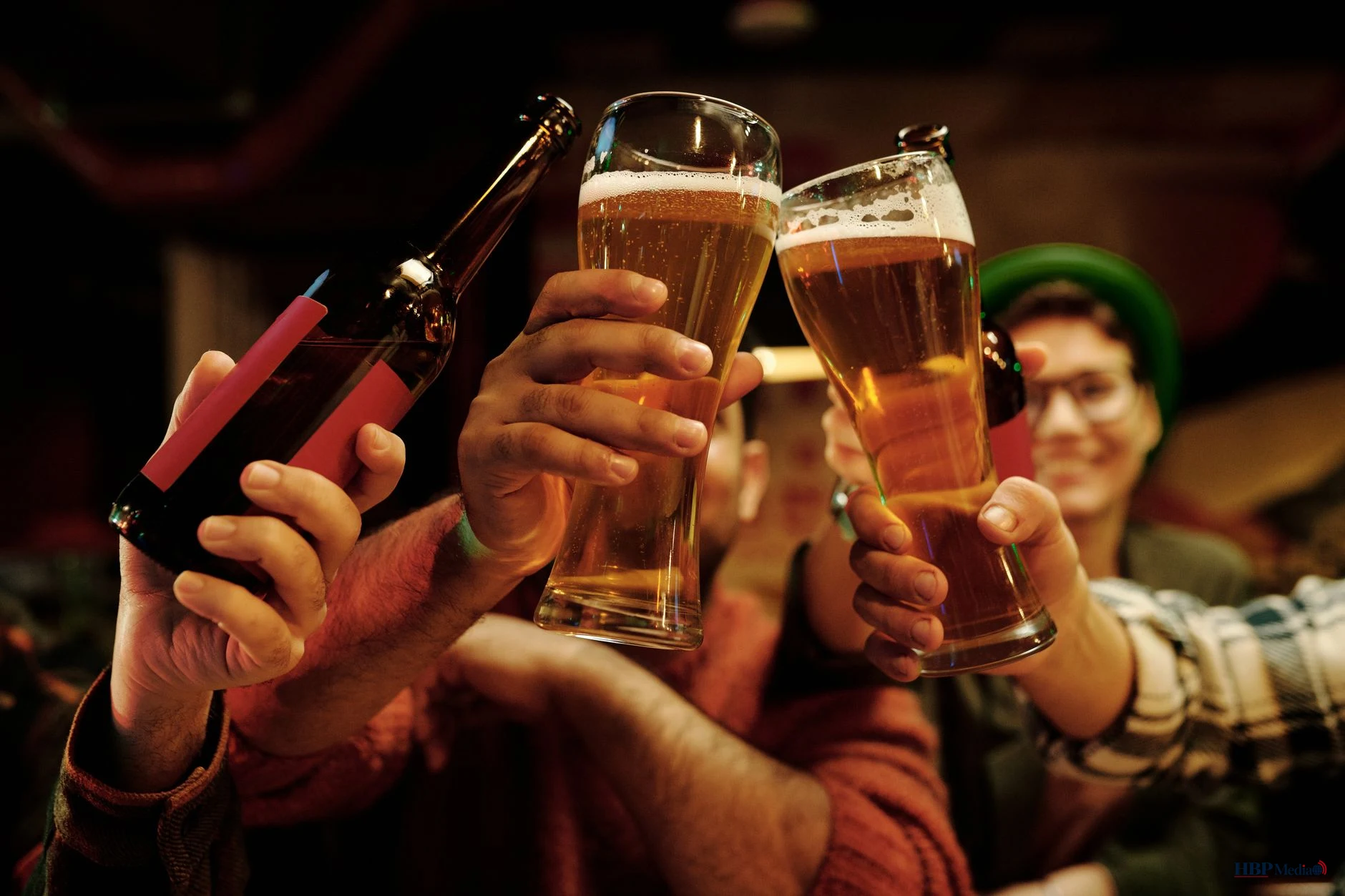 people tossing their drinks in celebration of the holiday