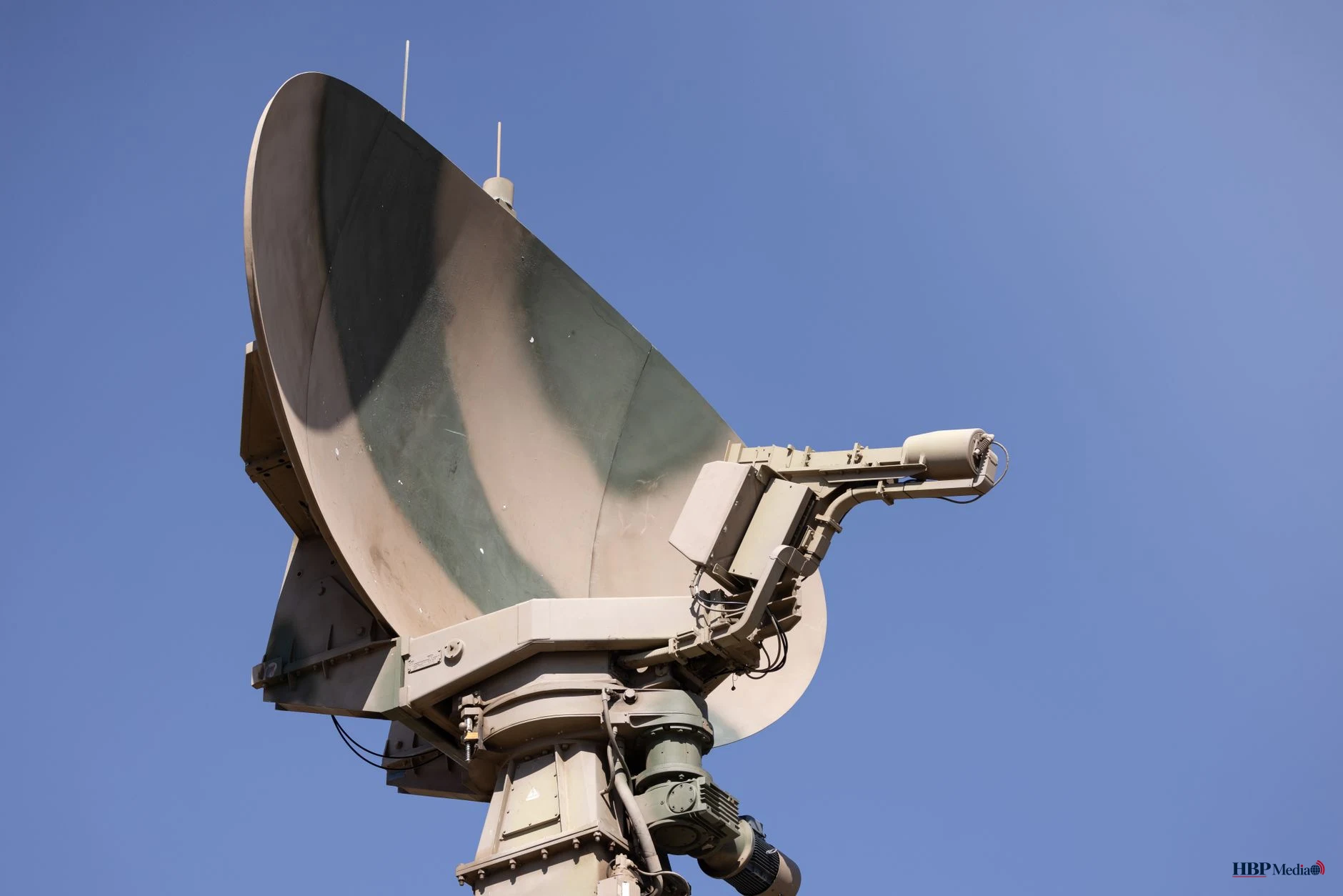 large military radar system against clear sky