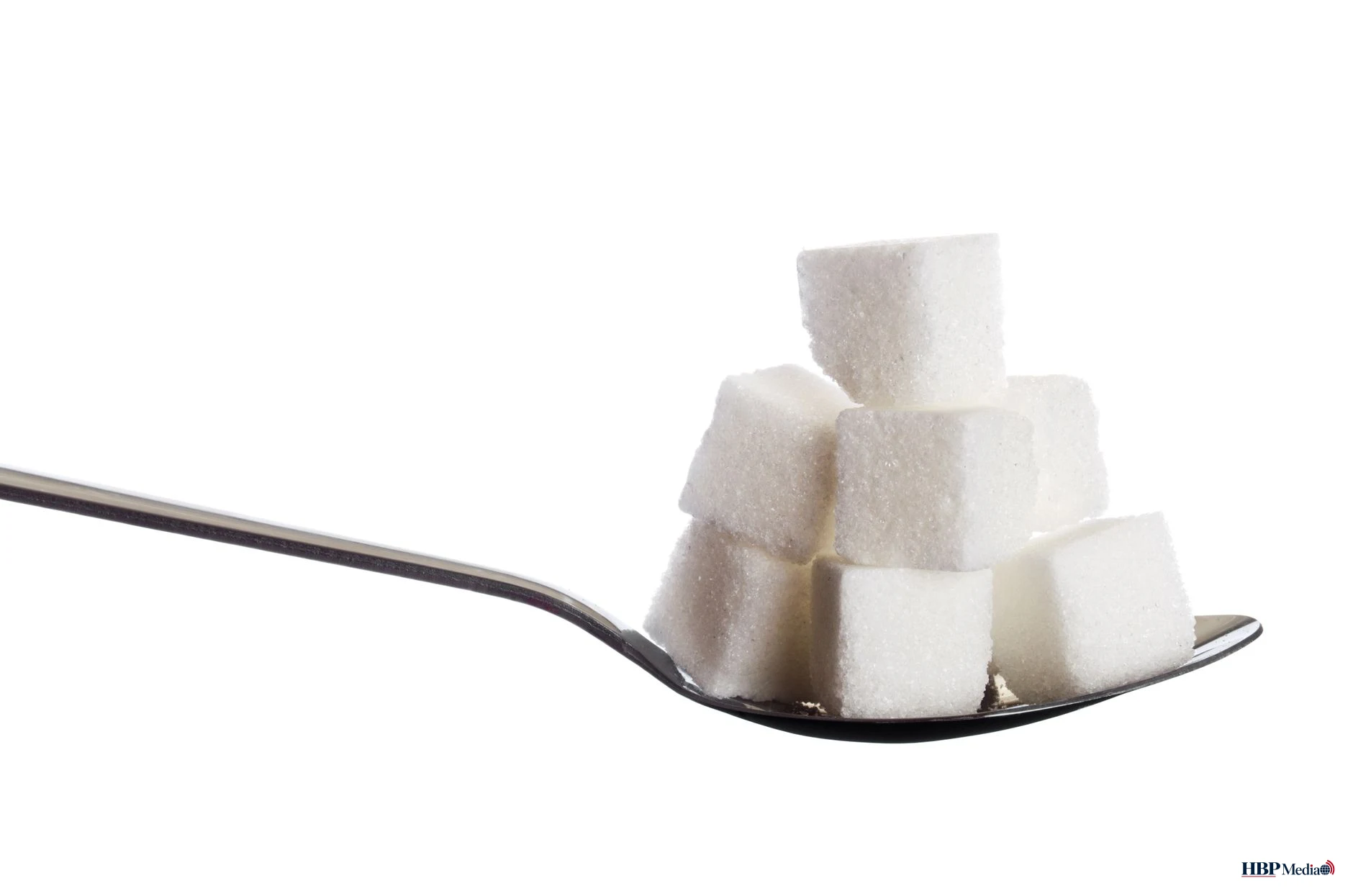 cubes of sugar on spoon