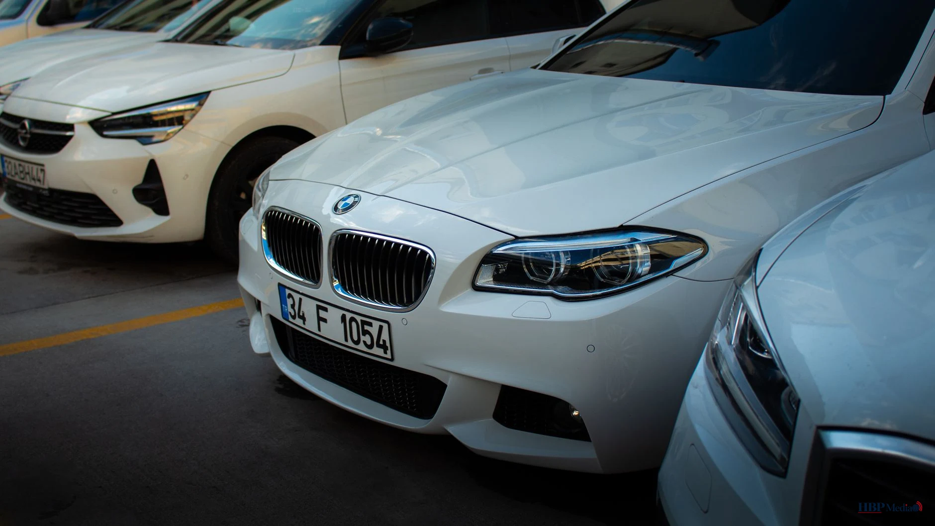 white bmw car in urban parking lot
