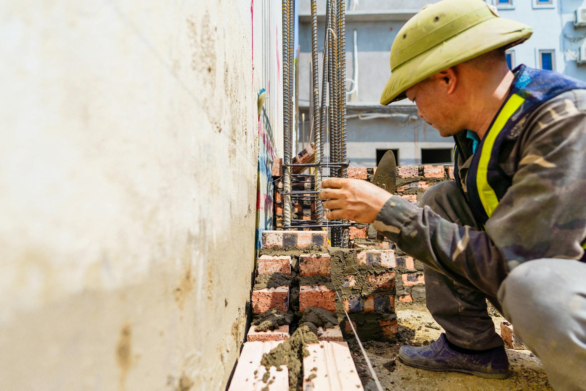 construction worker building wall in h i phong