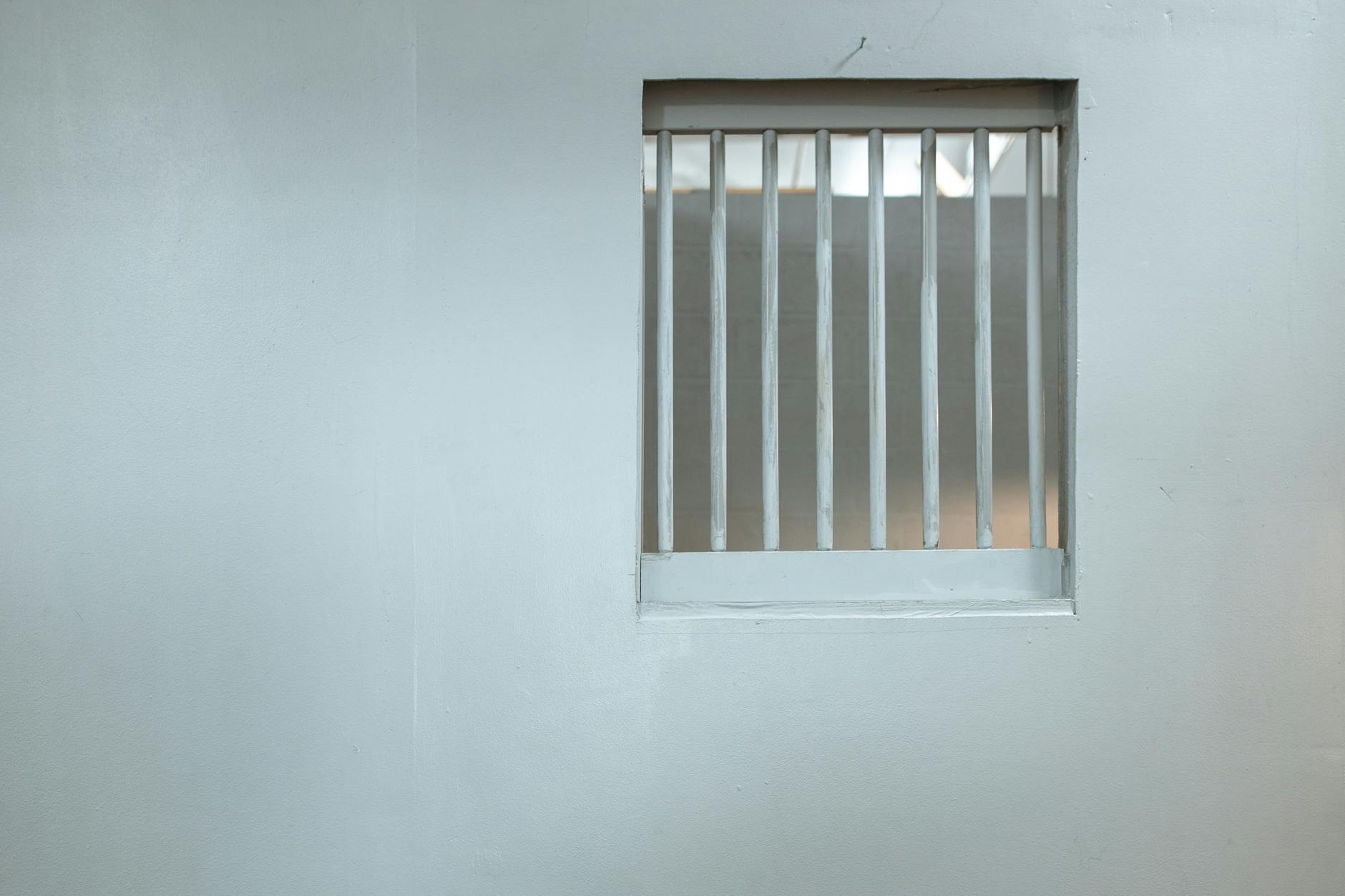 white steel bars window on a wall