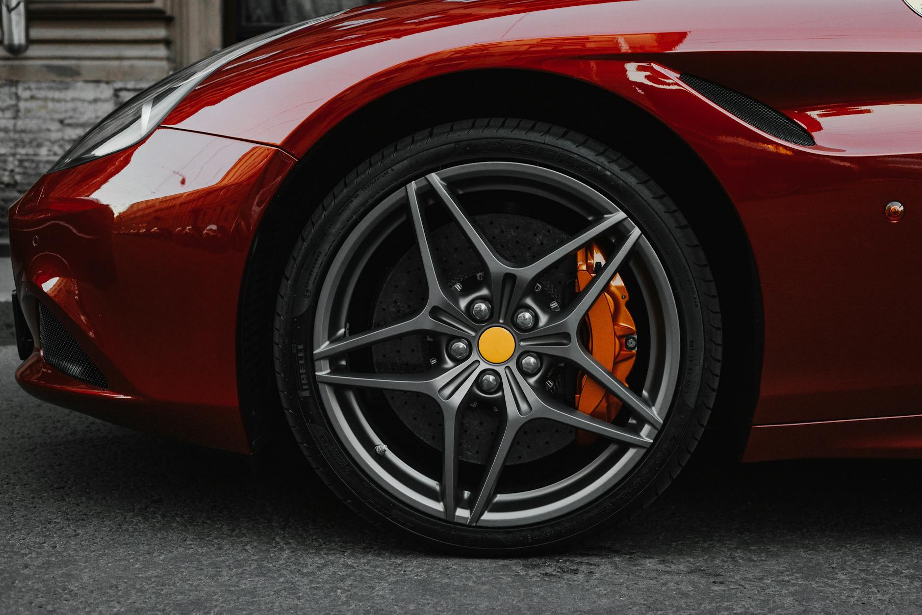 red car with gray wheel