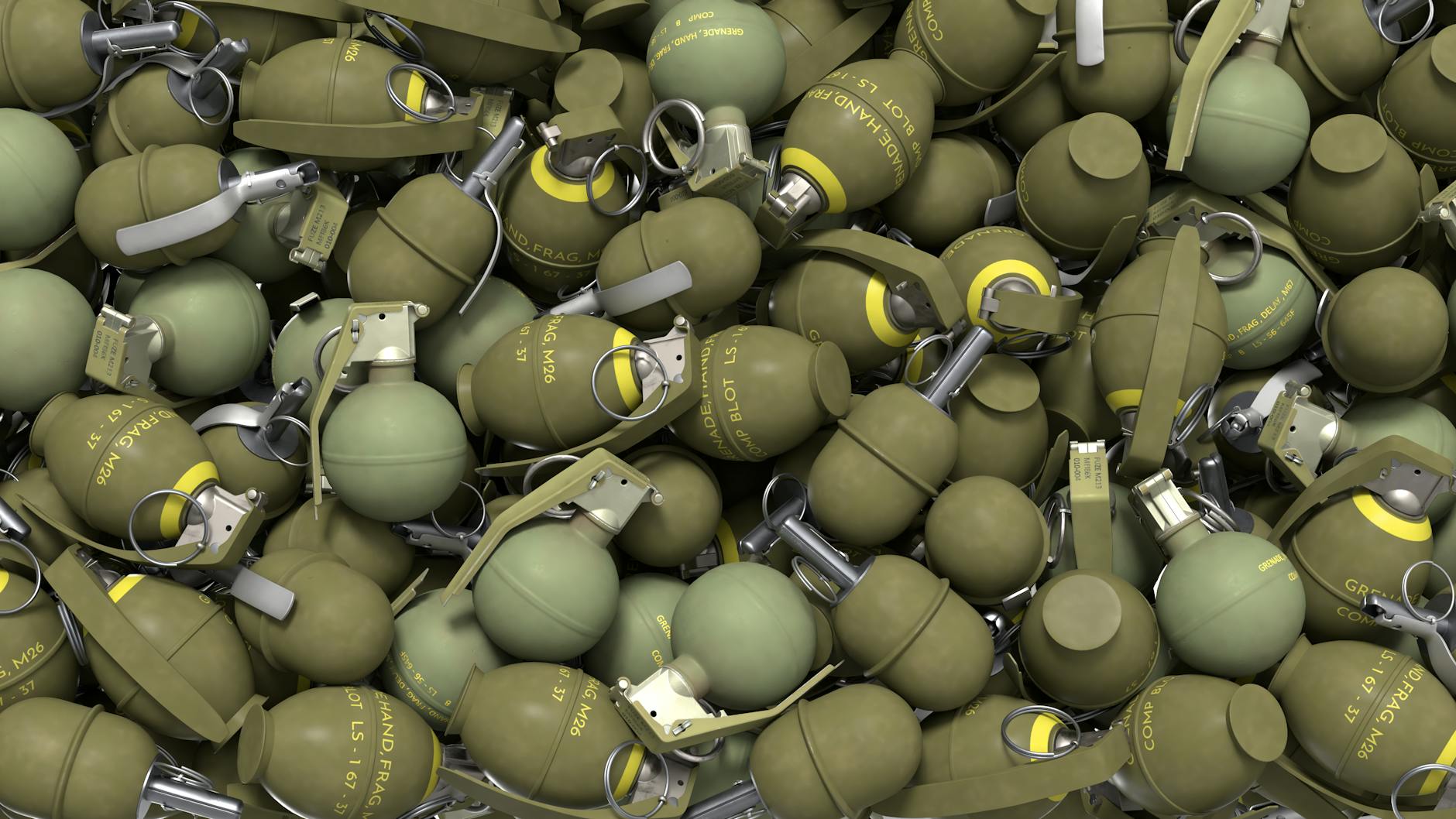 pile of military hand grenades in olive green