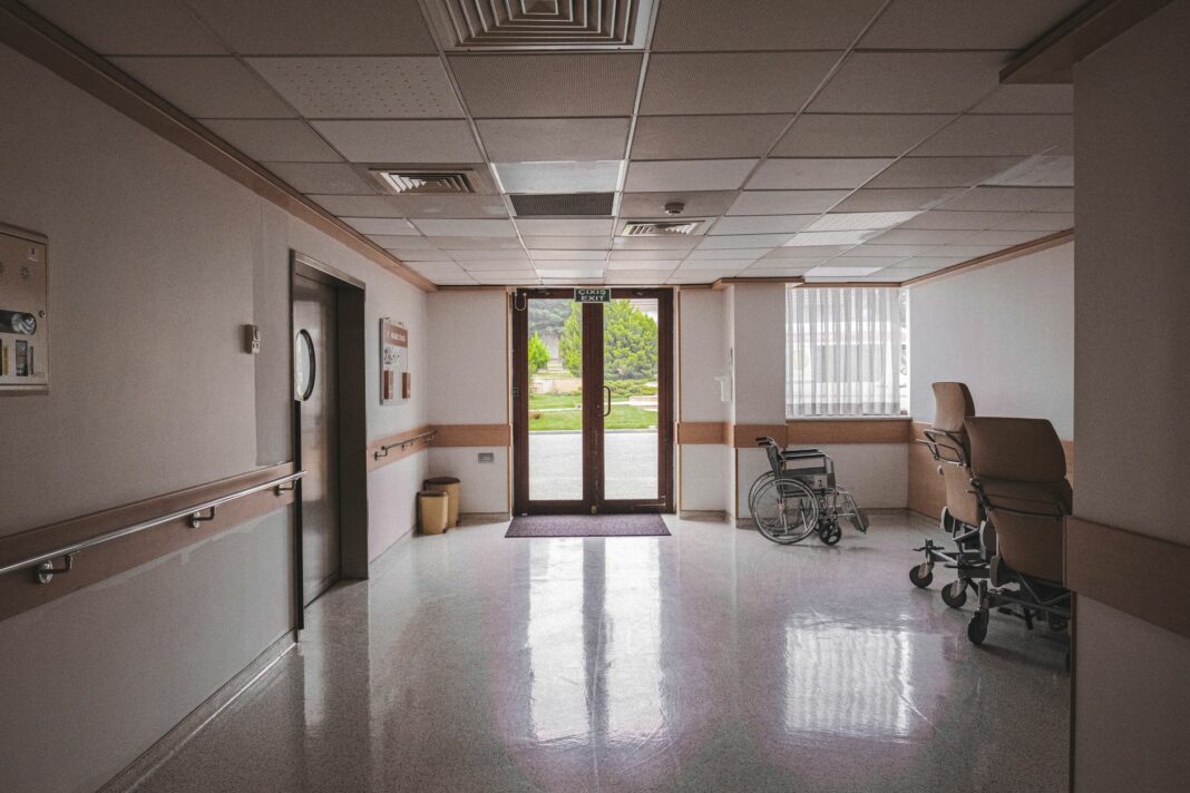 wheelchair near glass doors inside a building