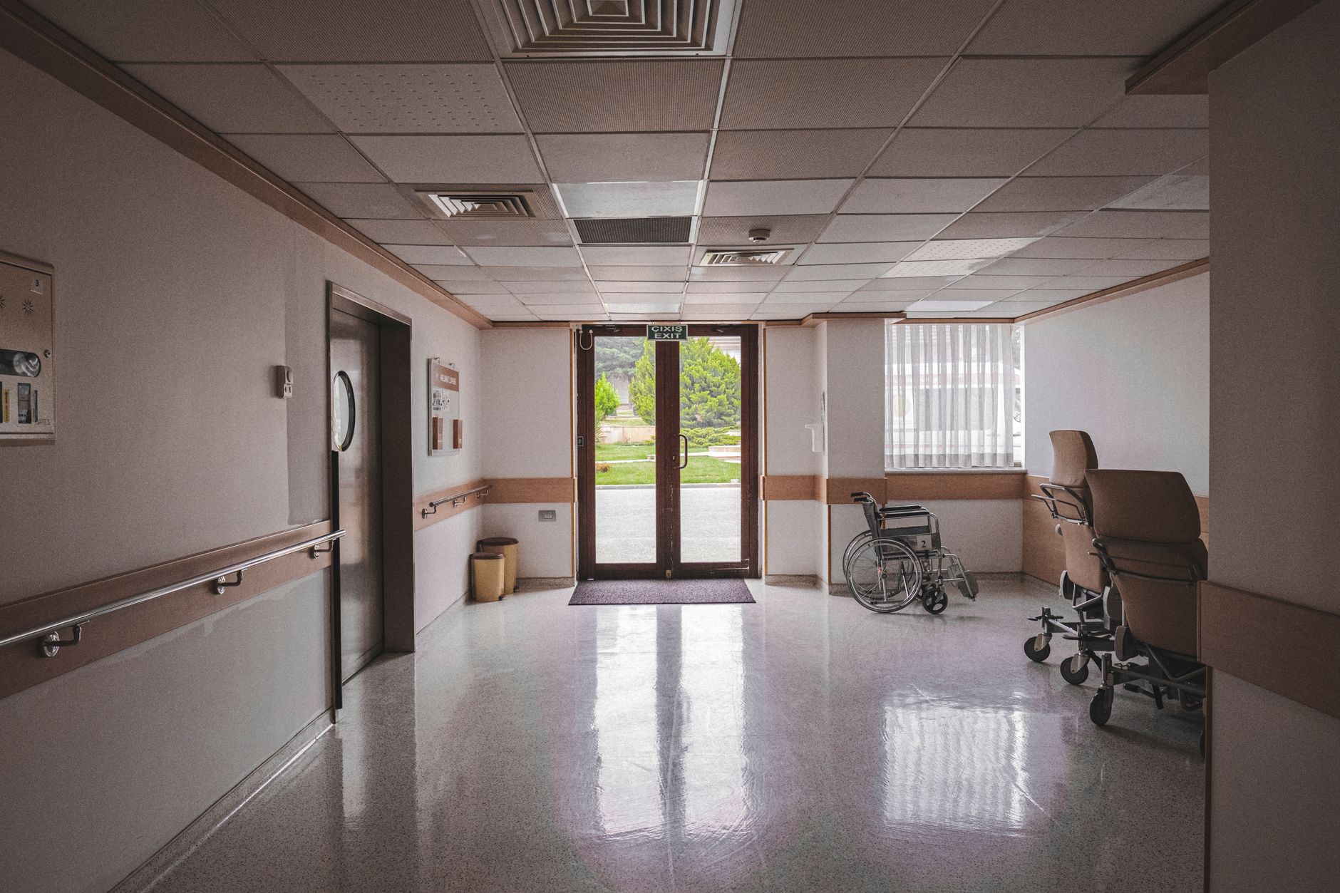 wheelchair near glass doors inside a building